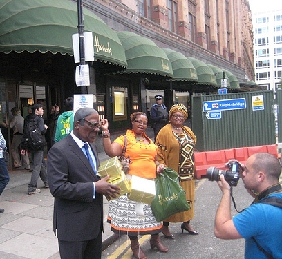 Protests dressed as Robert Mugabe and his wife outside Harrods department store in London